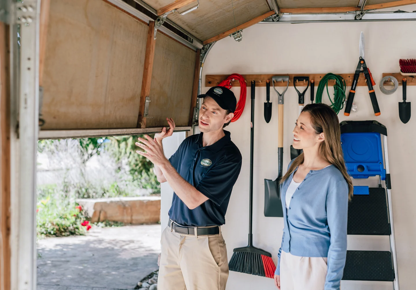 Precision technician inspecting a garage door